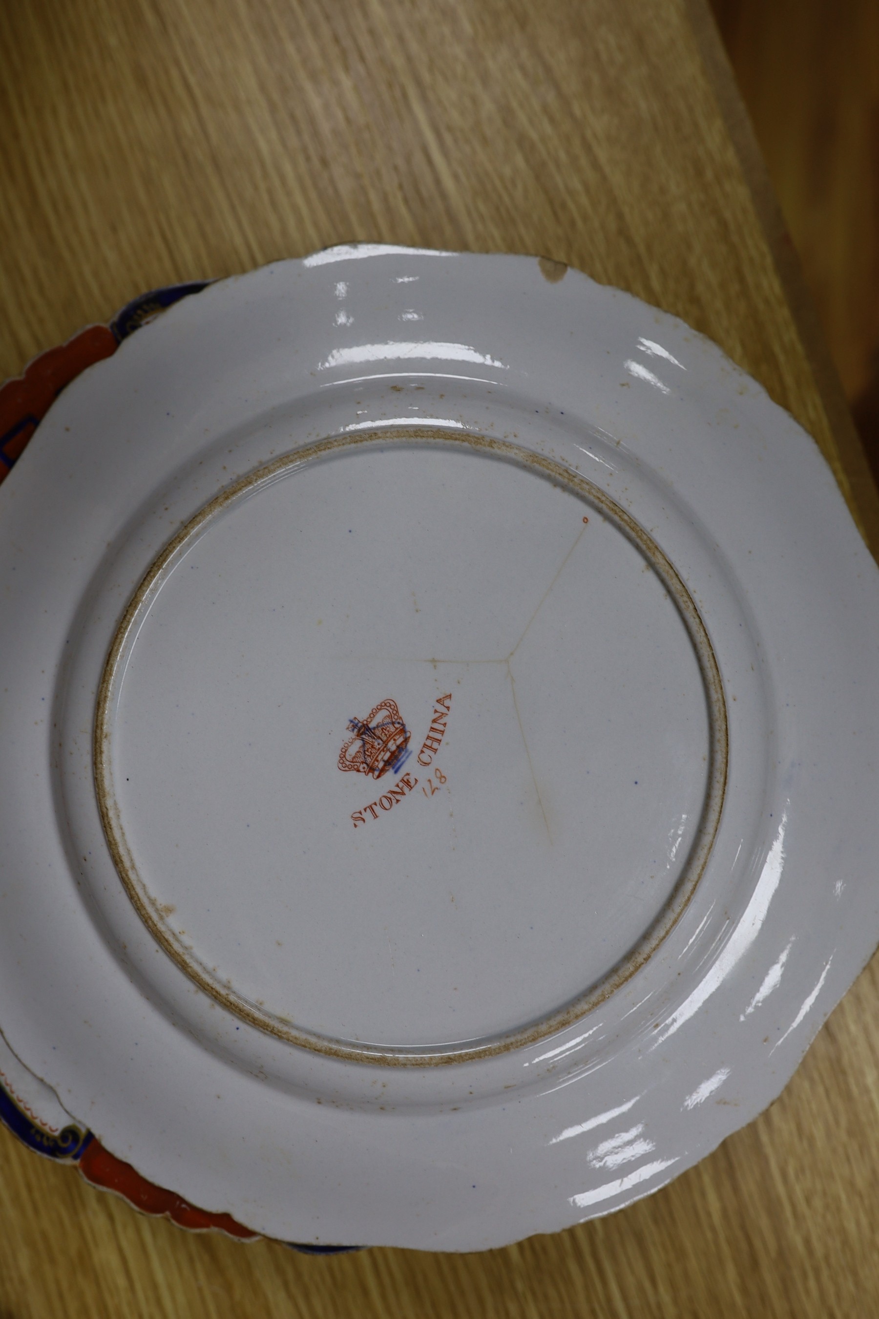 Eight early 19th century English 'Stone China' circular plates with cream, red and white decoration and six matching soup bowls